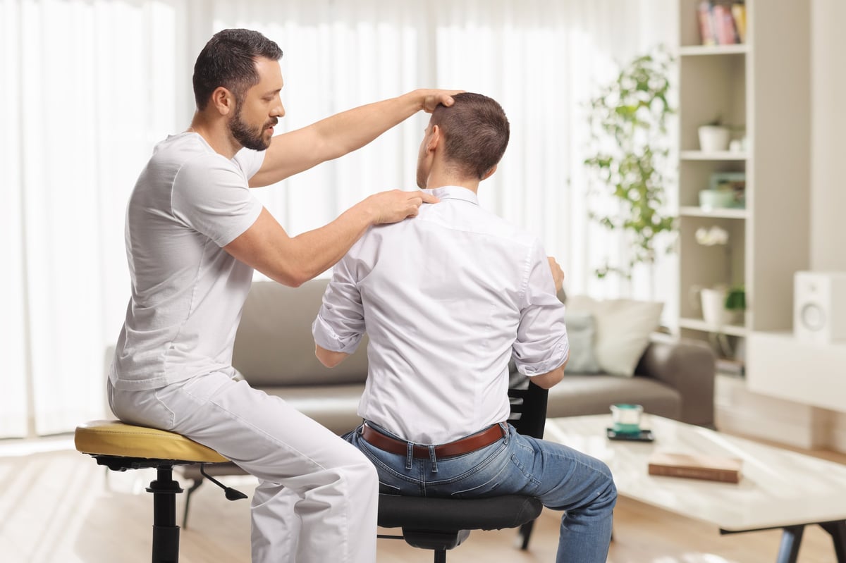 Chiropractor gently treating a patient for back pain